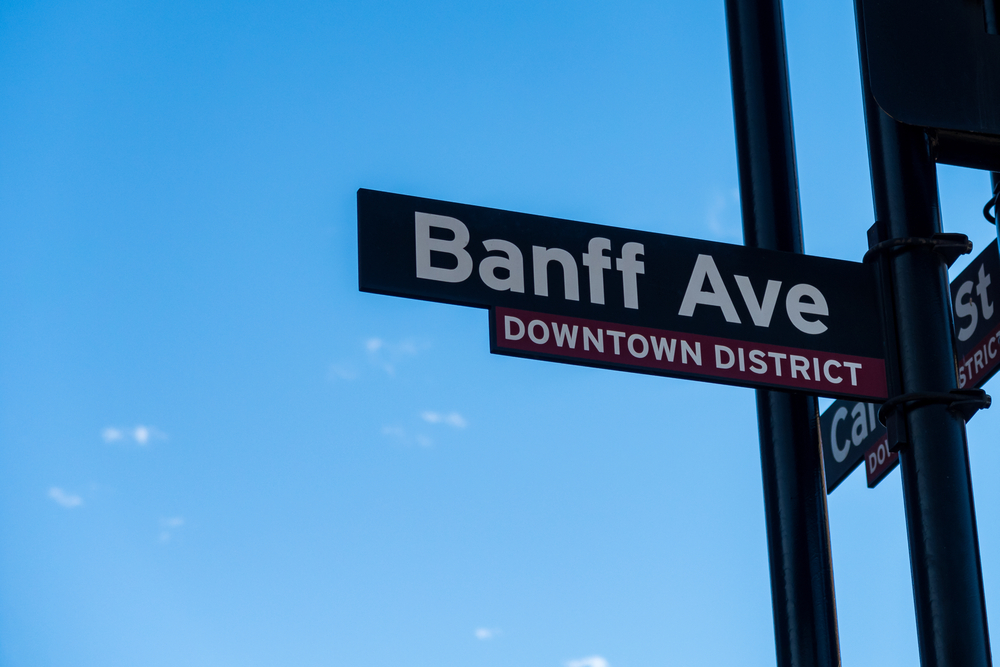 View,Of,Banff,Avenue,Road,Sign,With,Blue,Sky,In