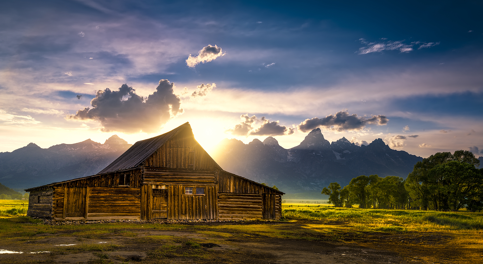 Sunset over the iconic Moulton barn on Mormon Row in Grand Teton National Park WY
