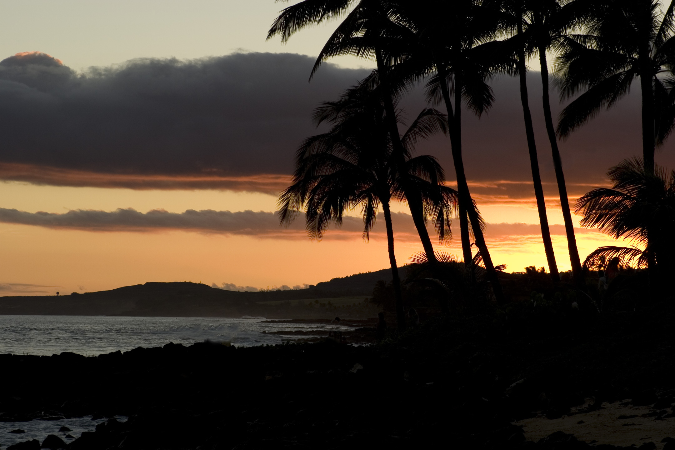 sunset on the island of kauai hawaii on poipu beach