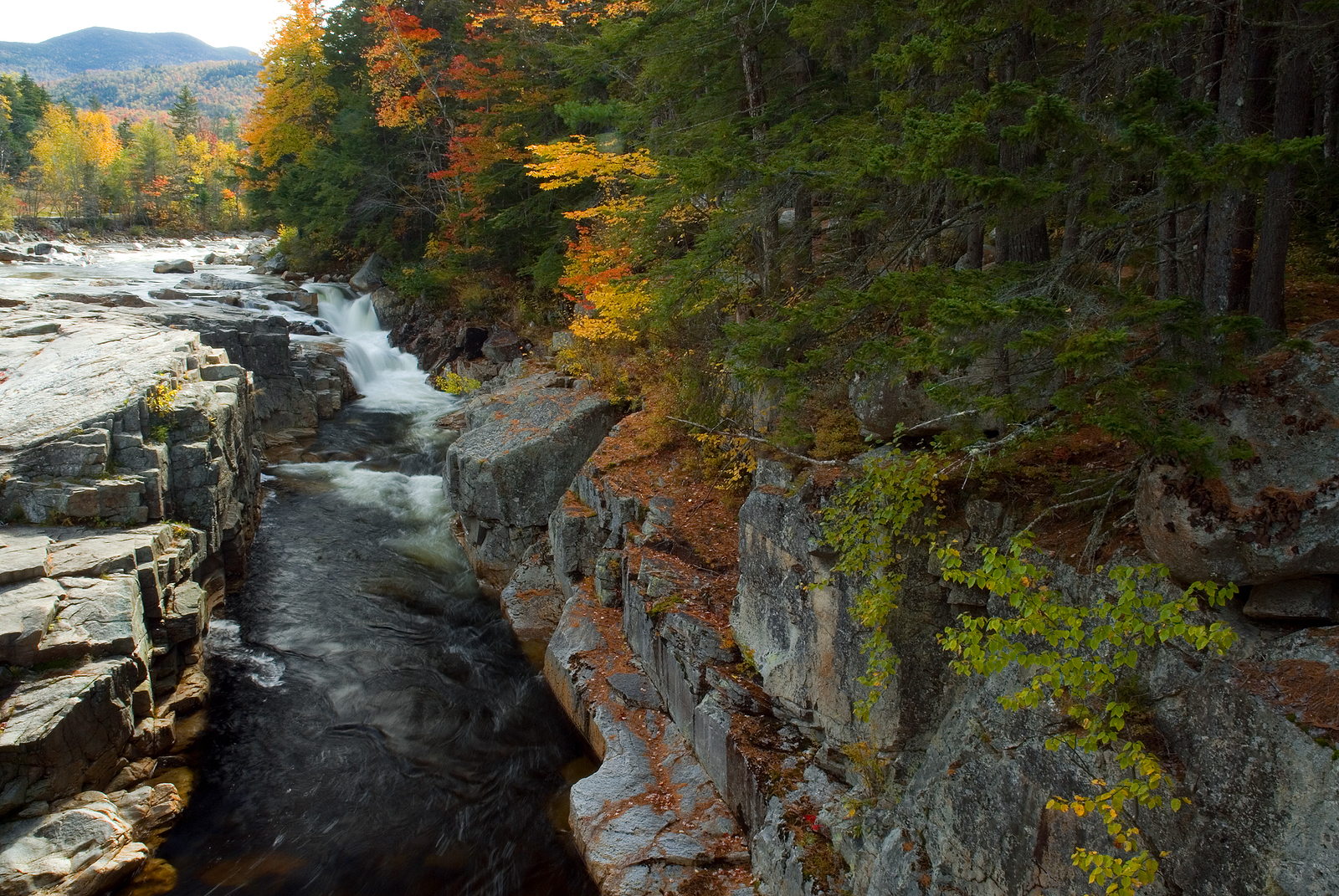 Rocky Gorge Falls along the Swift River just off the Kancamagus Highway in the White Mountains of New Hampshire. Peak fall colors add beauty to the scene.
